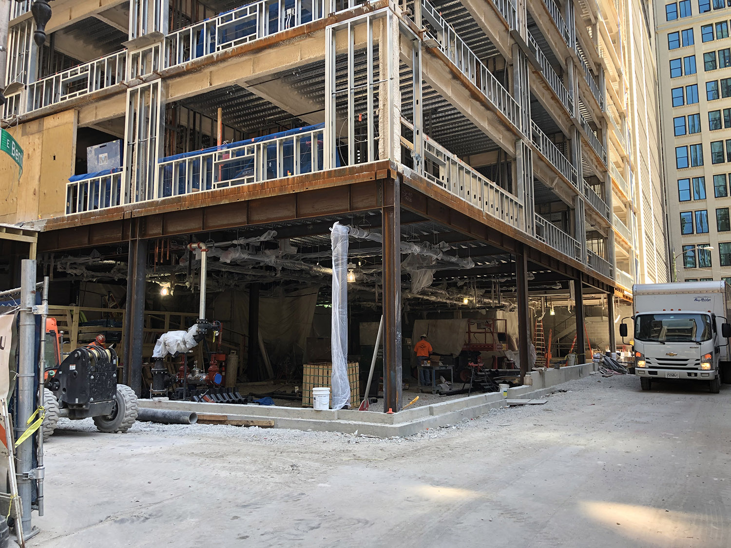 Workers Prep Ground Floor For Possible Fireproofing Spray. Image by Lukas Kugler