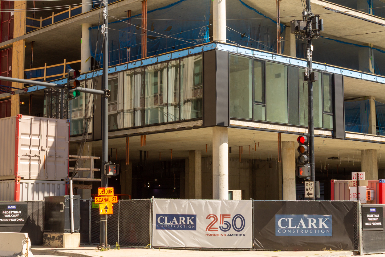 566 West Van Buren topped out, first glass