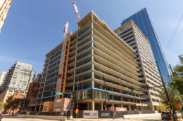 566 West Van Buren topped out, first glass