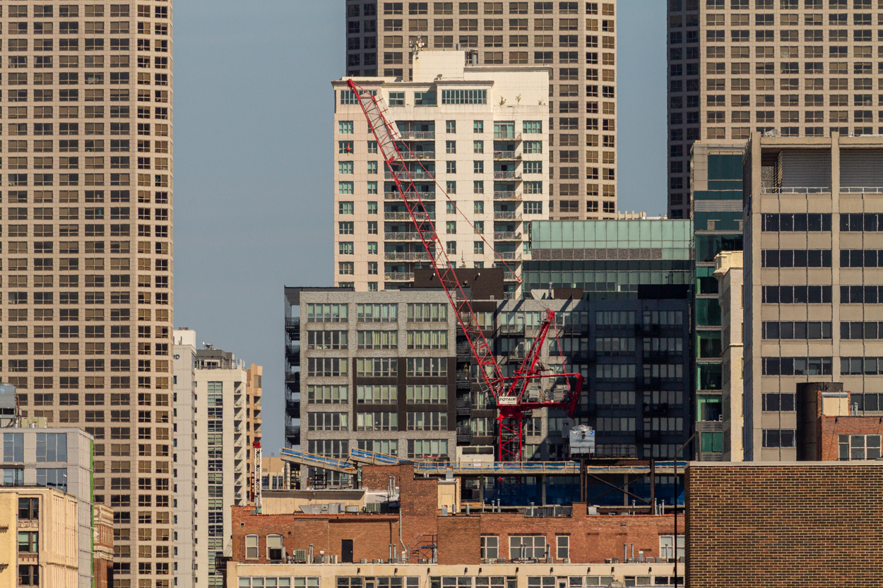 566 West Van Buren topped out, first glass