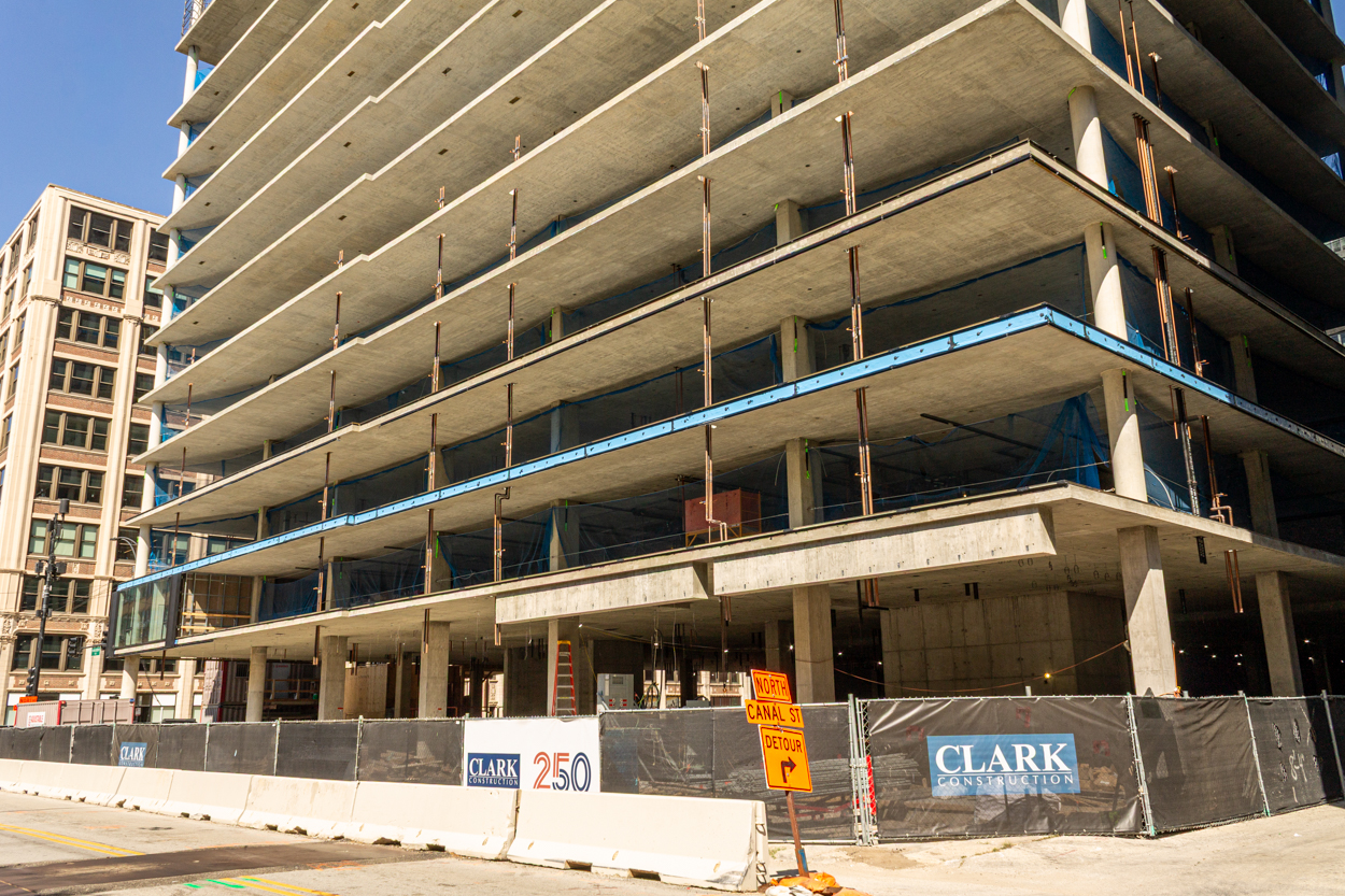 566 West Van Buren topped out, first glass