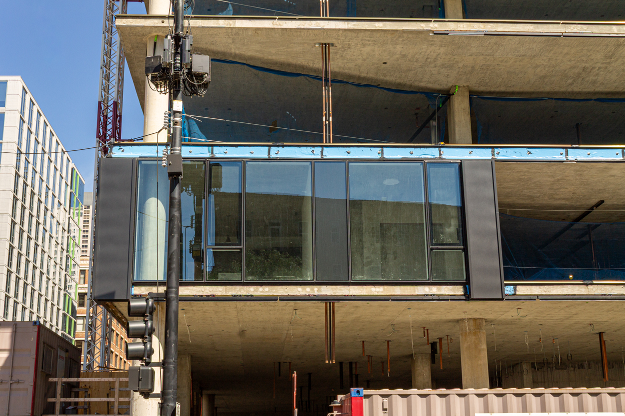 566 West Van Buren topped out, first glass
