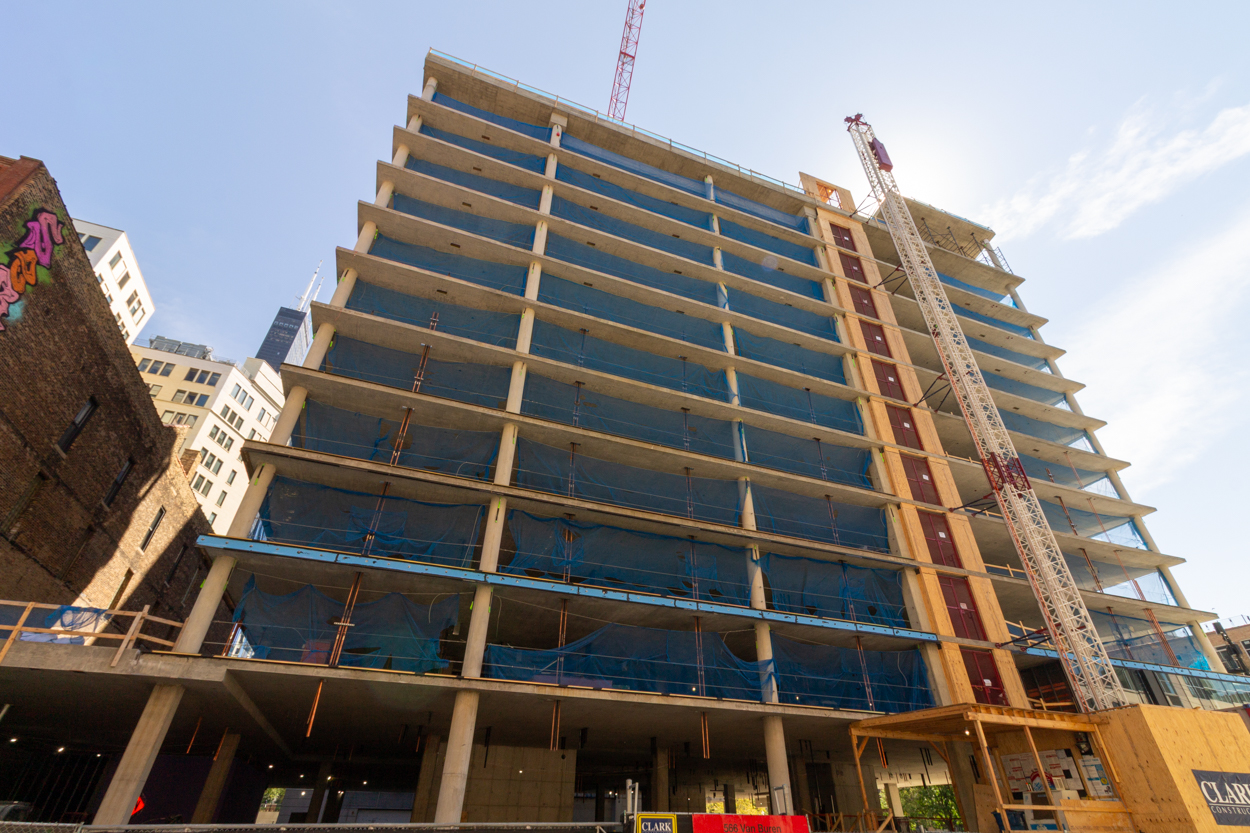 566 West Van Buren topped out, first glass